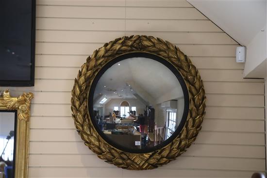 A fine large Regency giltwood and gesso convex wall mirror, Diam.3ft 6in.